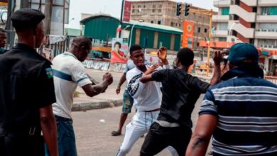 A fight breaks out over the alleged distribution of money for votes at a polling unit in Alagomeji-Yaba in Lagos on Feb. 23, 2019, during the general elections