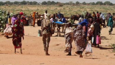 Families escaping the violence in Ardamata cross into Chad in early November. Photo: El Tayeb Siddig/Reuters